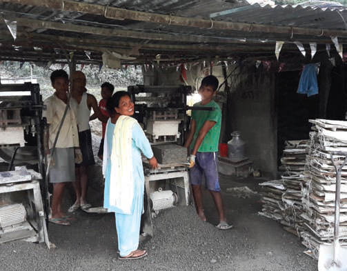 Ms. Phulan Thapa from Nursery Women Group promoted by Dulegouda branch of Tanahu district working in her cement block factory.