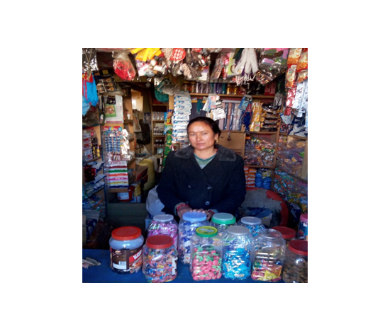 Cheering Yangjum Lama of Simikot branch , Humla infront of the grocery store financed by the Nirdhan Utthan Bank ltd loan of NPR 60,000.00.